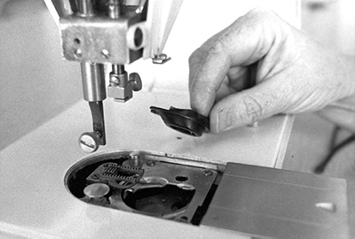 Photograph of cleaning the bobbin area.