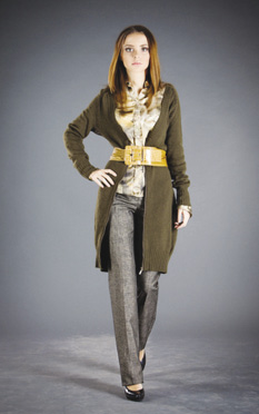 Photo of model wearing a wide belted blouse and sweater combo with gray trouser pants.