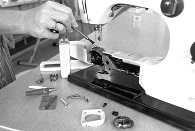 Photograph of removing all the parts possible in order to clean the machine thoroughly.