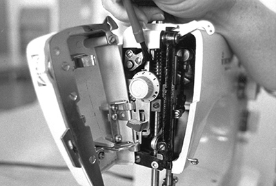 Photograph of removing lint from the face plate area using a soft brush.