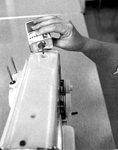 Photograph of placing one or two drops of oil in all holes designated by the instruction booklet.