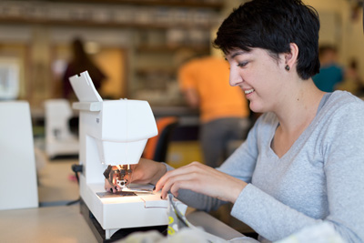 Photo of woman sewing