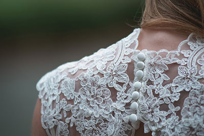 Photograph of the back of a garment showing buttons.