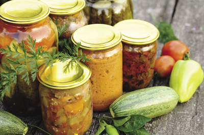Illustration showing procedure for filling canning jars before processing
