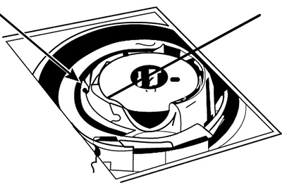 Illustration of the lower tension adjustment screw on bobbin.