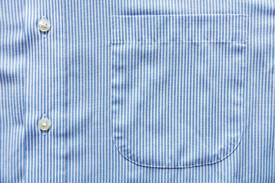 Photograph of a shirt with buttons and a pocket.