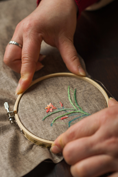 Photo of fabric properly secured in the hoop, ready for stitching.