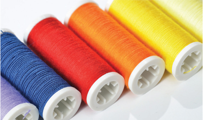 Photo of several types of threads and thread colors.