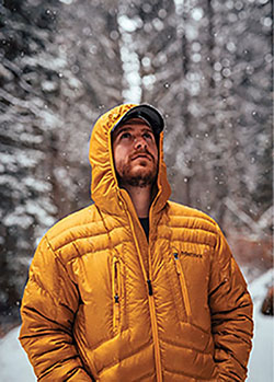 Photograph of a man wearing a yellow jacket.