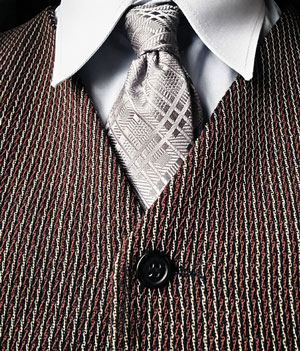 Photograph of a vest, shirt, and tie.