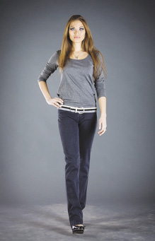 Photo of model wearing three-quarter sleeve round neckline knit T-shirt and belted blue straight leg pants.