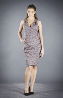 Photo of model wearing gray plaid-printed, V-neck, sleeveless knee-length dress.