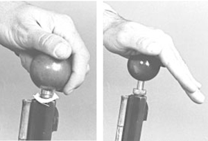 Photo of someone seating the bullet, by placing a lubricated patch over the muzzle and centering a bullet on it by using a short starter.