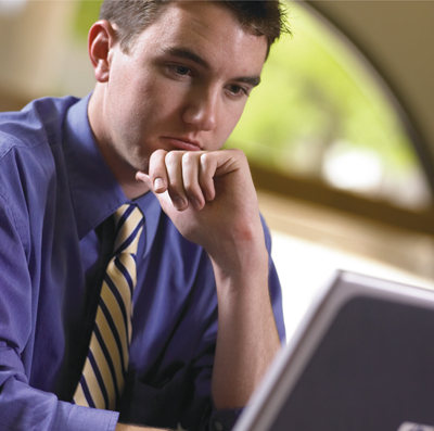 Stock photo of a man using a computer.