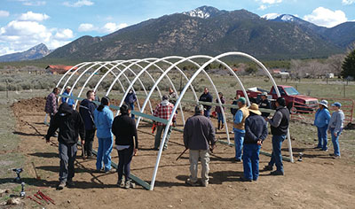 Figure 7: Photograph of all the bent PVC pipes forming the skeleton of the hoop house.