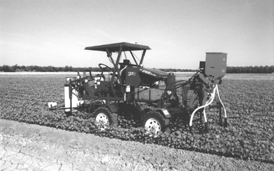 Fig. 1: Photograph of 4WD vehicle with IR, GPS, variable rate fertilizer applicator and insect vacuuming system. 