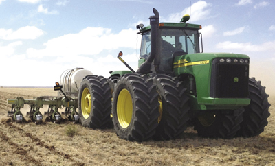 Photograph of a tractor with dual tires.