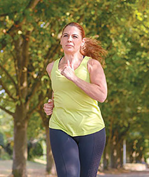 Photograph of a woman jogging.