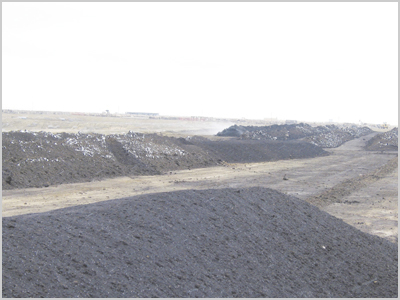 Fig. 1: Photograph of a covered compost pile. 