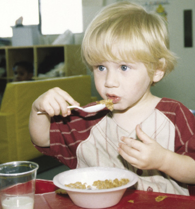 Photo of kid eating cereal