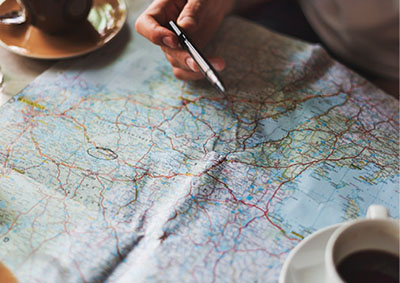 Photograph of a map and coffee cup.