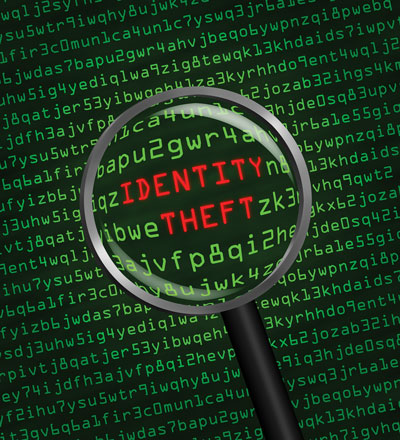 Image of a magnifying glass and the words “identity theft.”