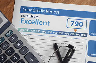 Photograph of a credit report and score.
