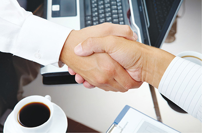 Photograph of two hands shaking.