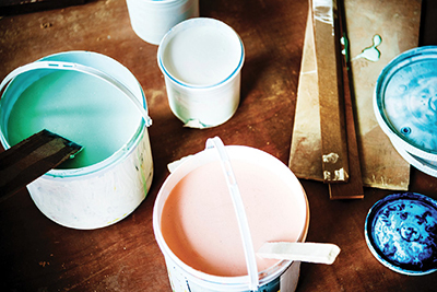 Photograph of paint buckets.
