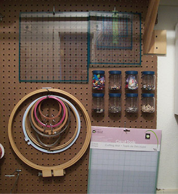 Figure 03: Photograph showing supplies stored on a pegboard with hooks.
