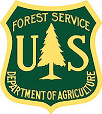 Photograph of Forest Service Department of Agriculture logo.