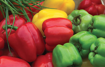 Photograph of bell peppers of different colors.