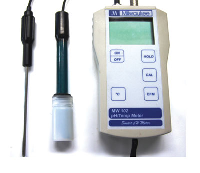 Photograph of a handheld pH meter with probe.
