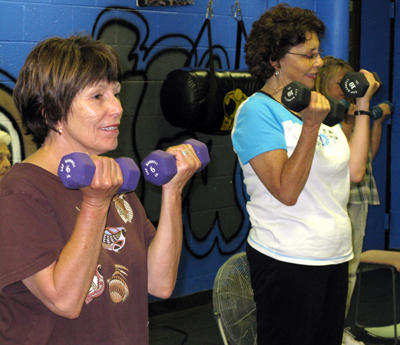 Fig. 2 Photo of ladies doing weight-lifting exercises.