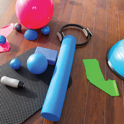 Photograph of bands, tubes, and medicine balls used for strength training.