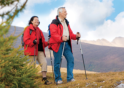 Photograph of a man and woman hiking.