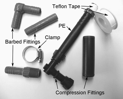 Fig. 6: Photograph showing examples of barbed and compression fittings, clamps, and Teflon tape.