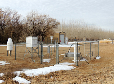 Photograph showing southwest view of the NWS weather station (WS-1) at the NMSU Agricultural Science Center at Farmington, NM, in January 2013.
